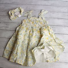 New With Tags Tahari Tiered Floral Sundress & Headband Toddler Girl Size 5t This Summer Sun Dress Is Off White Dotted Swiss With Golden Yellow And Pale Green-Ish Gray-Ish Blue Flowers. The Dress Has Gathered Ruffle Tiers With A Smocked Elastic Front Yoke With Wide Straps With Bow Accents. The Dress Is Full Cut And Is Lined With A Solid White Slip. The Set Also Includes A Headband. The Set Is Brand New With Tags. If You Have Twins Or Need More Than One, Let Me Know. I Also Have This Same Dress In Playful Smocked Floral Dress For Summer, Playful Smocked Dress With Floral Print For Summer, Playful Floral Smocked Dress For Summer, Playful Summer Smocked Dress With Floral Print, Playful Smocked Dress For Spring With Smocked Bodice, Spring Playful Smocked Dress With Smocked Bodice, Playful Smocked Dress With Smocked Bodice For Spring, Playful Multicolor Smocked Summer Dress, Playful Smocked Dress For Spring Vacation