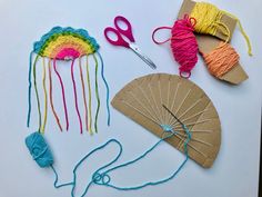 the craft kit is being made with yarn and scissors