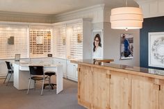 a room with many glasses on the wall