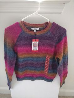 This BB Dakota By Steve Madden sweater is a must-have for any fashion-forward women's wardrobe. The tight-knit, long sleeve sweater features a crew neck and a flattering fit, making it perfect for any occasion. The pink ombre color adds a vibrant and modern touch to the sweater, making it a novelty piece that will make you stand out. Made with a blend of acrylic, elastane, polyester, wool, and nylon, this knit sweater is both comfortable and durable. The sweater is easy to care for and should be hand washed to ensure it retains its vibrant colors. This pullover sweater is designed in a size XS and is perfect for travel, workwear, or casual occasions. Please see pictures of the item and condition. Thank you for checking us out 😊 Ombre Color, Bb Dakota, Pink Ombre, Sweater Making, Women's Wardrobe, Colorful Fashion, Sleeve Sweater, The Pink, Pullover Sweater