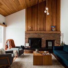 a living room filled with furniture and a fire place