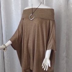 This Fabulous Loose-Fitting Unconstructed Cowl Neck Shirt Is Comprised Of 100% Lyocell And Made In The Usa. It Is Meant To Be Oversized And The Cowl Neck Is Versatile So You Can Wear It In Many Ways. Contact Us With Questions. Bundle This With One Of Our Other 1,000 Items And Save Even More. New Merchandise Arrives Daily. Oversized Short Sleeve Poncho, Oversized Neutral Blouse For Fall, Fall Lagenlook Batwing Sleeve Tops, Oversized Tunic For Layering, Chic Long Sleeve Poncho, One Size Brown Tops For Layering, Chic One Size Poncho With Batwing Sleeve, Brown One Size Tops For Layering, Oversized Beige Blouse For Fall