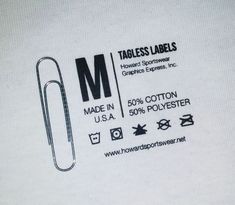 a white t - shirt with the words labels labels and an image of a paper clip