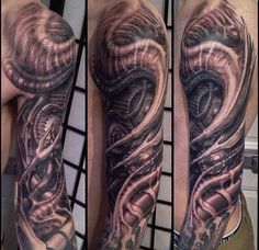 a man's arm with tattoos on it and an image of a snake in the middle