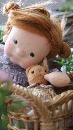 a close up of a stuffed animal in a basket