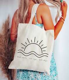 This 100% cotton bag comes in one size - 15" x 16"- perfect for everyday wear. While the canvas material will show off your designs in great colors, it's durable and will last for years. The bag features 20" handles (made from the same canvas), making it easy to carry even with a week's worth of shopping. .: 100% cotton canvas .: Available in natural and black colors .: Heavy fabric (12 oz/yd² (406.9 g/m .: Sewn-in label Cotton Summer Beach Bag, Everyday Summer Cotton Beach Bag, Cotton Tote Shoulder Bag For Beach Season, Cotton Canvas Bag For Daily Use And Beach Season, White Cotton Beach Bag For Travel, Summer Cotton Tote Canvas Bag, White Cotton Canvas Bag For Beach Season, Trendy Cotton Canvas Bag For Beach Season, Summer Cotton Shoulder Bag For Travel