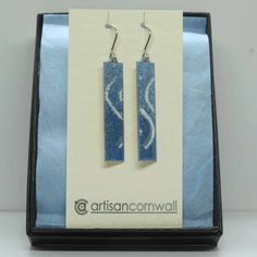 Sea themed contemporary enamel earrings in tones of turquoise and white on an aluminium base ✦  These individual long rectangular earrings feature multiple layers of enamel resin fused onto an aluminium base.  They are attached to surgical steel ear wires and are supplied with a pair of silicon stoppers. ✦  I've used mixes of blue shaded enamel resin to create a dappled turquoise base and then created 'wave tops' using accents of white.  A final transparent layer finishes the design and catches Artistic Enamel Earrings For Gifts, Artistic Enamel Earrings, Hand Painted Blue Enamel Earrings, Blue Enamel Earrings With Artistic Design, Turquoise Enamel Dangle Earrings, Rectangular Earrings, Artist Card, Abstract Earrings, Contemporary Earrings