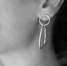 "These double hoops earrings are such a statement, yet they stands out for their simplicity. Made in sterling silver, the earrings are very comfortable to wear. The small hoop is a circle, whereas the bigger hoop has a pebble like shape, which gives to the piece a more natural look. Great accessory for your minimalist look, and amazing gift idea! Measures/Details Small hoop diameter: 0.6\" (1.5 cm) Big hoop measures: 1.6\" by 1.2\"(4 cm by 3 cm) All my pieces are carefully handmade. Irregulariti Pebble Earrings, Modern Silver Earrings, Handmade Silver Jewellery, Double Hoop Earrings, Accesories Jewelry, Big Hoop Earrings, Silver Earrings Handmade, Hoops Earrings