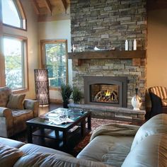 a living room filled with furniture and a fire place