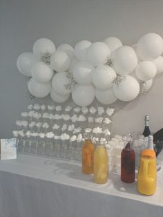 balloons and condiments on a table with drinks