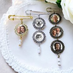 three different photo clips on top of a white doily with flowers in the background