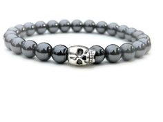 "FREE SHIPPING (United States) Our hematite beaded bracelet is unisex in design. This stone has iron in it which makes it heavier then our other stones. Hematite is great in color and helps absorb negative energy and calms in times of stress. Hematite is known as \"The Blood Stone\" for grounding, focus and confidence. These stones are sourced from Canada and is the most abundance mineral found on the Earth's surface. With each purchase you will receive a card with the above information to go al Hematite Bracelet With Polished Beads As Gift, Silver Hematite Jewelry With 8mm Beads, Hand-strung Hematite Crystal Bracelet As Gift, Silver Hematite Bracelets With Gemstone Beads, Hematite Beaded Bracelet With Silver Beads, Hematite Bracelet With 8mm Beads, Hematite Stretch Bracelet With 8mm Beads, Silver Hematite Bracelets With Round Beads, Silver Hematite Beaded Stretch Bracelet