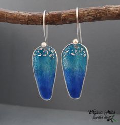 "Want something for a different look during the day? These Dangle Earrings with Ocean Blue Enamel will add a unique look to an outfit. The handmade 925 Silver Earrings are made of sterling silver and Turquoise blue enamel. These long blue Earrings are perfect to wear for any opportunity and also light. Details: Weight: 3 g each one Width: 13 mm = 0.51\" Length: 30 mm = 1.18\" Enjoy and thanks for looking! Follow me: www.facebook.com/jewelersoul Visit my shop for a matching also pendants: https:/ Unique Blue Sterling Silver Earrings, Artistic Blue Nickel-free Jewelry, Artistic Blue Earrings With Ear Wire, Blue Drop Earrings Pierced, Handmade Blue Sterling Silver Earrings, Unique Blue Dangle Earrings, Unique Blue Drop Earrings, Artistic Blue Sterling Silver Earrings, Blue Unique Drop Earrings