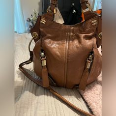 Great Used Condition Tan Color May Have Flaws That I Didn’t See I’ve Never Used This And Bought It Second Hand Designer Hobo Bag With Metal Hardware For Daily Use, Versatile Shoulder Bag With Branded Hardware For Everyday, Double Handle Hobo Bag With Metal Hardware, Leather Crossbody Bucket Bag With Branded Hardware, Designer Hobo Bag With Metal Hardware For Travel, Designer Hobo Bag With Branded Hardware For Everyday, Designer Hobo Bag With Metal Hardware For Everyday, Leather Satchel Bucket Bag, Leather Bucket Bag With Double Handle And Branded Hardware