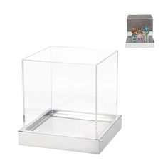 a clear box with two children in it and an empty photo frame on the side