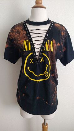 "Nirvana Lace Up Band Top T Shirt - Grunge - Smiley Face Nevermind Each piece is uniquely designed and one of its' kind. Hand stitched edge detailing for superior quality and unique finish. Please note, since this is a handmade item, there may be slight variances with each T. UNISEX Sizing (women may choose to size down depending on fit preference) Appx. Measurements Laying Flat: S: 17\" across chest Width x 28\" Length M: 19\" across chest Width x 29\" Length L: 21\" across chest Width x 31\" L Soft Grunge Outfits, Tokyo Street Fashion, Hipster Grunge, Concert Tees, Vintage Grunge, Top T Shirt, Mode Inspo, Grunge Style, T Shirt Diy