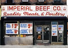 the front of a restaurant called imperial beef co, quality meats and poultry with prices displayed