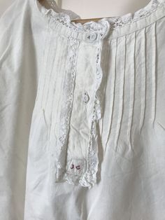 Vintage Light French Cotton Night Dress Sourced Loire Valley, France. Hand and Machine Sewn. Lace at Arms and Neck **Free Shipping Measurements Shoulders 18 1/2 in Waist 63 in Length 39 in Condition Good Vintage. Buttons intact, seams intact, Lace intact. Very small dots of stain on back of night dress (see photo) 🌹 🌹 🌹 🌹 🌹 🌹 🌹 🌹 🌹 🌹 🌹 🌹 🌹 🌹 I MUST HAVE YOUR EMAIL AND TELEPHONE NUMBER ON YOUR ORDER FOR FRENCH LA POSTE SHIPPING NOTIFICATION AND TRACKING. Please note: Your purchase w Cotton Tops With Lace Trim For Bedtime, Vintage White Night Dress, Cotton Chemise With Lace Trim For Daywear, Cotton Dresses With Buttons For Loungewear, White Buttoned Dress For Loungewear, Summer Bedtime Nightgown With Buttons, Fitted Cotton Nightgown For Hospital, White Buttoned Sleepwear For Sleepover, Summer Nightgown With Buttons