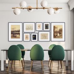 a dining room with green chairs and pictures on the wall