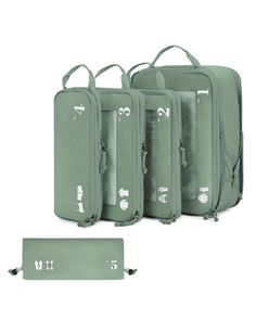 four pieces of luggage sitting next to each other with numbers on them and tags attached