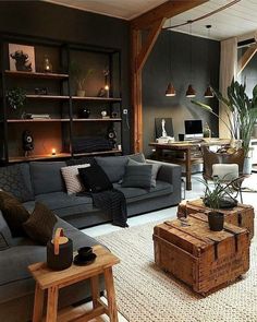 a living room filled with furniture and a wooden table in front of a couch on top of a rug