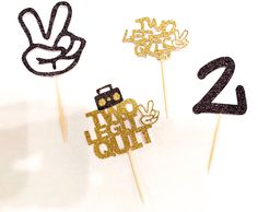 three cake toppers with the number twenty two