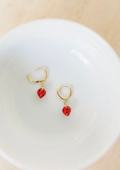 These beautiful strawberry charm hoops are a perfect huggie hoop, and make a great addition to any ear stack! These earrings are available in gold vermeil (18k gold plating over sterling silver) metal and are great for sensitive ears! Check out our other earrings here: https://www.etsy.com/shop/satinstitchdesigns?ref=l2-shopheader-name§ion_id=23495161 PLEASE NOTE: All of my items are custom made. The colors on your monitor may differ slightly from the color delivered. Please read my shop policie Cute Huggie Hoop Earrings For Valentine's Day, Cute Hypoallergenic Huggie Hoop Earrings, Valentine's Day Cute Huggie Hoop Earrings, Dangle Huggie Earrings With Charms For Gifts, Red Huggie Earrings Gift, Red Huggie Earrings For Gift, Cute Huggie Hoop Earrings, Cute Hypoallergenic Huggie Earrings, Hypoallergenic Red Hoop Earrings For Everyday