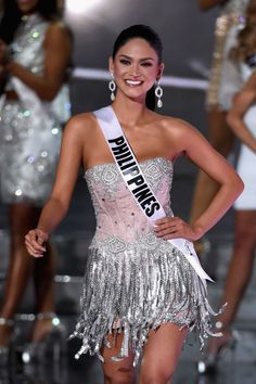 a woman in a silver and pink dress