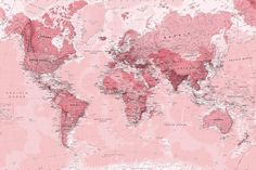 a white chair sitting in front of a wall with a pink world map on it