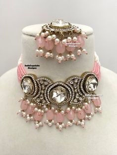 Premium quality Kundan pearls Choker comes with gorgeous Earrings and Tikka/ Indian Jewelry/Unique Polki and Kundan Jewelry/pink   All items are shipped from Brampton, Ontario, Canada. If you need your item by a certain day, please reach out to us for express delivery option before placing the order so that we can update the shipping for you. Standard shipping/delivery timeline Below are the delivery timeline estimates. We dispatch all orders by the next business day. ---> USA delivery timeline Pink Beaded Kundan Necklace For Diwali, Pink Round Beads Jewelry Sets For Party, Pink Jewelry Sets With Round Beads For Parties, Festive Pink Jewelry Sets, Festive Pink Round Jewelry Sets, Pink Bridal Sets For Party And Festive Occasions, Pink Bridal Sets For Party, Festive Pink Bridal Sets For Party, Pink Kundan Jewelry Sets