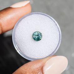 This loose stone is available for a custom ring by Anueva Jewelry. Select your stone first and then select a setting. Add both to your cart and we'll create your ring! 1.27CT ROUND MADAGASCAR SAPPHIRE, SMOKEY GREEN GREY indoors and Blue Teal green in natural light, 6.07X4.20X3.42MM Smokey green grey coloring with natural internal silk. This sapphire has internal inclusions and a slightly uneven cut which can be hidden by the setting of your choice. About Heat Treatments: Some colored gemstones a Gia Certified Sapphire Gemstones As Gift, Gia Certified Round Gemstones For Gift, Made For Mermaids, Colored Gemstones, Sapphire Color, Custom Ring, Breath In Breath Out, Antique Inspiration, Jewelry Ring Box