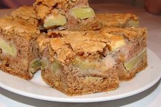 several pieces of apple pie on a white plate