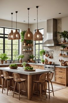 a kitchen filled with lots of potted plants and hanging lights above the counter top