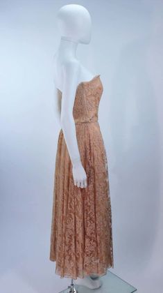 For Sale on 1stDibs - This Ceil Chapman cocktail dress is composed of a nude lace. Features a draped strapless style with side floral applique. There is a center back zipper Ceil Chapman, 1950s Outfits, Strapless Cocktail Dress, Dress With Flowers, Lace Strapless, Floral Applique, Flower Dresses, Strapless Dress, Evening Dresses