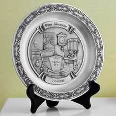 a silver plate with an emblem on it