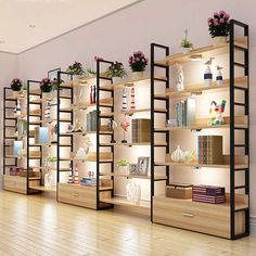 an empty room with shelves filled with books and vases