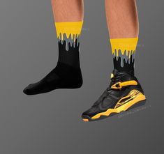 These Jordan 8s Retro 'Taxi' inspired all-over-print socks are extra comfortable thanks to their cushioned bottom. The foot is black with artwork printed along the leg with crisp, bold colors that won't fade.  * 60% nylon/22% cotton/18% spandex * Crew length * Cushioned bottom * Ribbed leg * Cold wash with like colors and hang dry * A great year-round gift idea with graphics inspired by the Jordan 8s Retro 'Taxi' colorway! * Perfect gift for any sneakerhead! * The Jordan 8s Retro 'Taxi' shown is Casual Non-slip Socks For Sports Events, Non-slip Casual Sports Socks, Black Non-slip Socks For Sports Events, Black Non-slip Socks For Sports, Casual Black Socks For Sports Events, Black Breathable Socks For Streetwear, Black Socks For Streetwear, Jordan 8s, Matching Socks