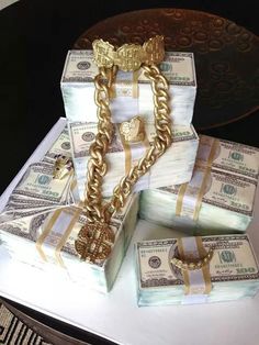 stacks of money wrapped in gold chains on top of each other