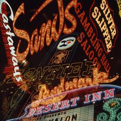 the neon sign for sands casino and resort in las vegas, nv at night