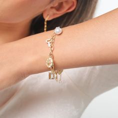 This Pearl Moon Star Bracelet adds a touch of elegance to your outfit. Its eight-pointed star symbolizes power and protection, while pearls create a delicate focal point. Wearing this exquisite piece is sure to give you the feeling of luxury, exclusivity, and timeless beauty. DETAILS Plating: 18K Gold Materials: 18K Gold on Brass, Imitation Pearl, Zircon Measurements: Length:  6.69 " (17.0cm)  + Extender: 1.97" (5.0cm) Weight:  15 g Eight Pointed Star, Pearl Charm Bracelet, Astrology Jewelry, Blue Morpho Butterfly, Blue Morpho, Butterfly Gifts, Purple Grapes, Enamel Necklaces, Star Bracelet