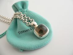 Overview:Offered for sale is a wonderful, very rare and gorgeous Tiffany & Co. Silver & Large Smoky Quartz Gemtone Toggle necklace. Definitely a Tiffany piece that you will get your money's value for. It works perfectly with pretty much any attire your put on, AND is an awesome statement piece. It is the perfect necklace that fits a lifestyle on the go -- the piece can be worn to pretty much any occasion! It is simple, elegant, and classic all rolled into one. Imagine wearing the piece with your Designer Pendant Jewelry For Formal Occasions, Designer Polished Finish Necklace Gift, Designer Hallmarked Jewelry For Collectors, Designer Sterling Silver Necklace Gift, Designer Sterling Silver Necklace For Gift, Designer Engraved Necklace For Gift, Luxury Sterling Silver Rectangular Necklace, Luxury Rectangular Sterling Silver Necklace, Designer Engraved Rectangular Jewelry