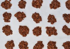 chocolate granola cookies are arranged on a white surface