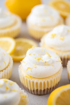 cupcakes with white frosting and lemon slices