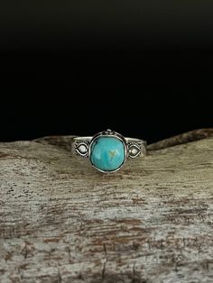 Bali Design Turquoise Ring // Handmade  Sizes 6-10 available  Metal: 925 Sterling Silver  Face Height : 9mm Weight: 3 grams Stone: natural turquoise (actual stone may vary slightly from picture) Finish: Oxidized Hallmark 925 Turquoise Larimar Ring As Gift, Turquoise Larimar Ring For Gift, Unique Turquoise Larimar Ring, Unique Turquoise Larimar Gemstone Ring, Turquoise Larimar Round Ring, Turquoise Larimar Ring, Adjustable Larimar Turquoise Ring, Adjustable Turquoise Larimar Ring, Adjustable Turquoise Healing Ring