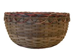 a brown basket with red and black handles