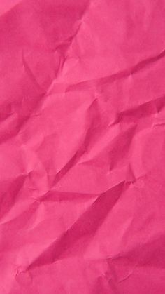 a piece of pink paper that has been folded