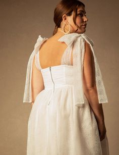 the back of a woman's white dress