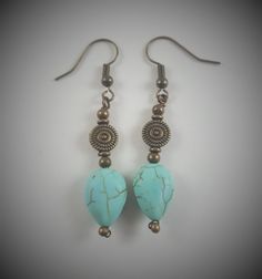 These earrings are handcrafted with bronze colored copper wire and artificial turquoise beads.  The earrings measure approximately 1 ½" from the top of the earring to the bottom.  This measurement does not include the ear hooks. Colors may appear different than they actually are depending on your monitor color settings and the lighting used during photography. Every item I create is made with great care and attention to detail; however as with all handmade items, there may be small imperfections in each item, but I like to refer to them as "added interest".  I would like to take this moment to thank you all for allowing me to share my craft! Handmade Turquoise Beaded Metal Earrings, Handmade Turquoise Beaded Earrings, Turquoise Beaded Earrings With Metal Ear Wire, Adjustable Turquoise Beaded Copper Earrings, Turquoise Beaded Copper Earrings, Handmade Turquoise Earrings With Copper Wire, Turquoise Wire Wrapped Copper Earrings, Earrings Artificial, Earrings Wire