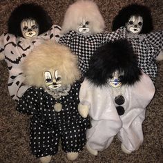 five creepy dolls are lined up on the floor