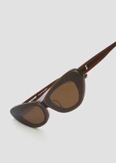 Slim cat-eyed acetate frame with unique Infinity Lenses. Metal Love Note detailing on temples. Brown frames with brown lenses.